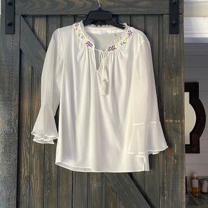 White blouse with beaded appliqué